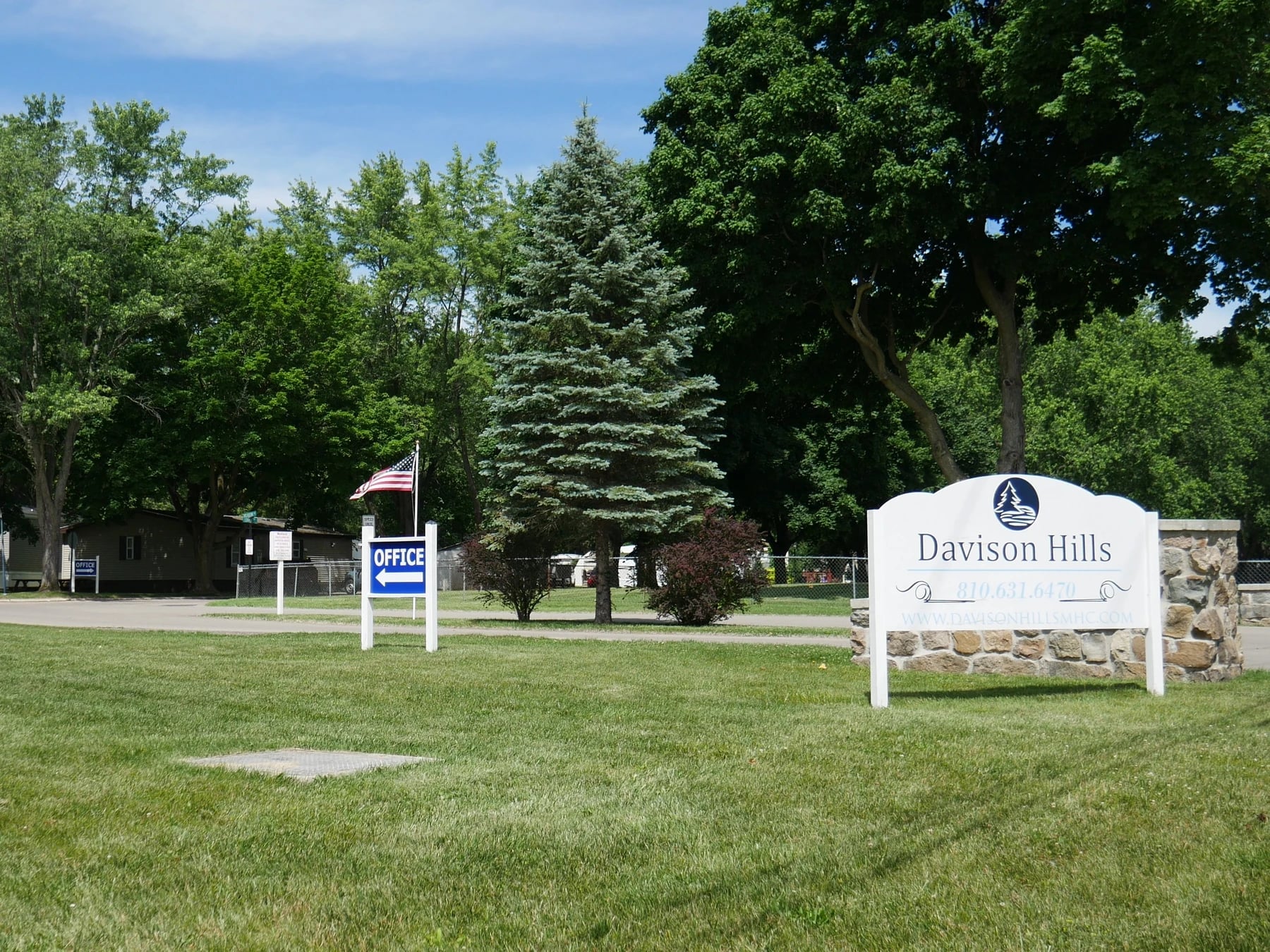 Davison Hills sign beside the landscaped community entrance